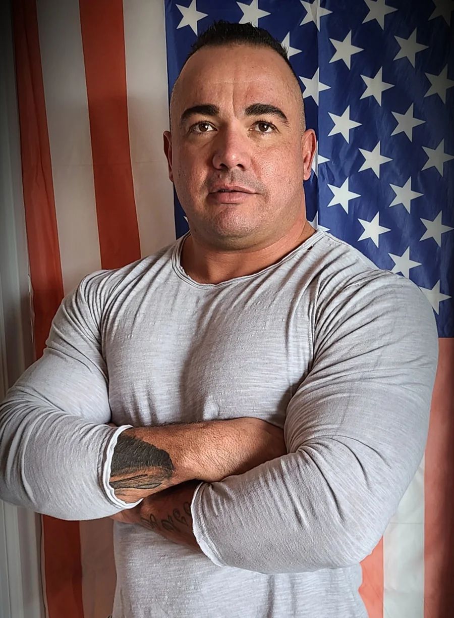 Shane Dickey in front of an American flag